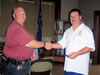 Clinton Wakefield (MCVFPA Fire Police Commissioner) receives his Life Membership from President Dave Wilson. (127,213 bytes)